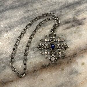 Rough cut sapphire and sterling silver pendant with silver chain